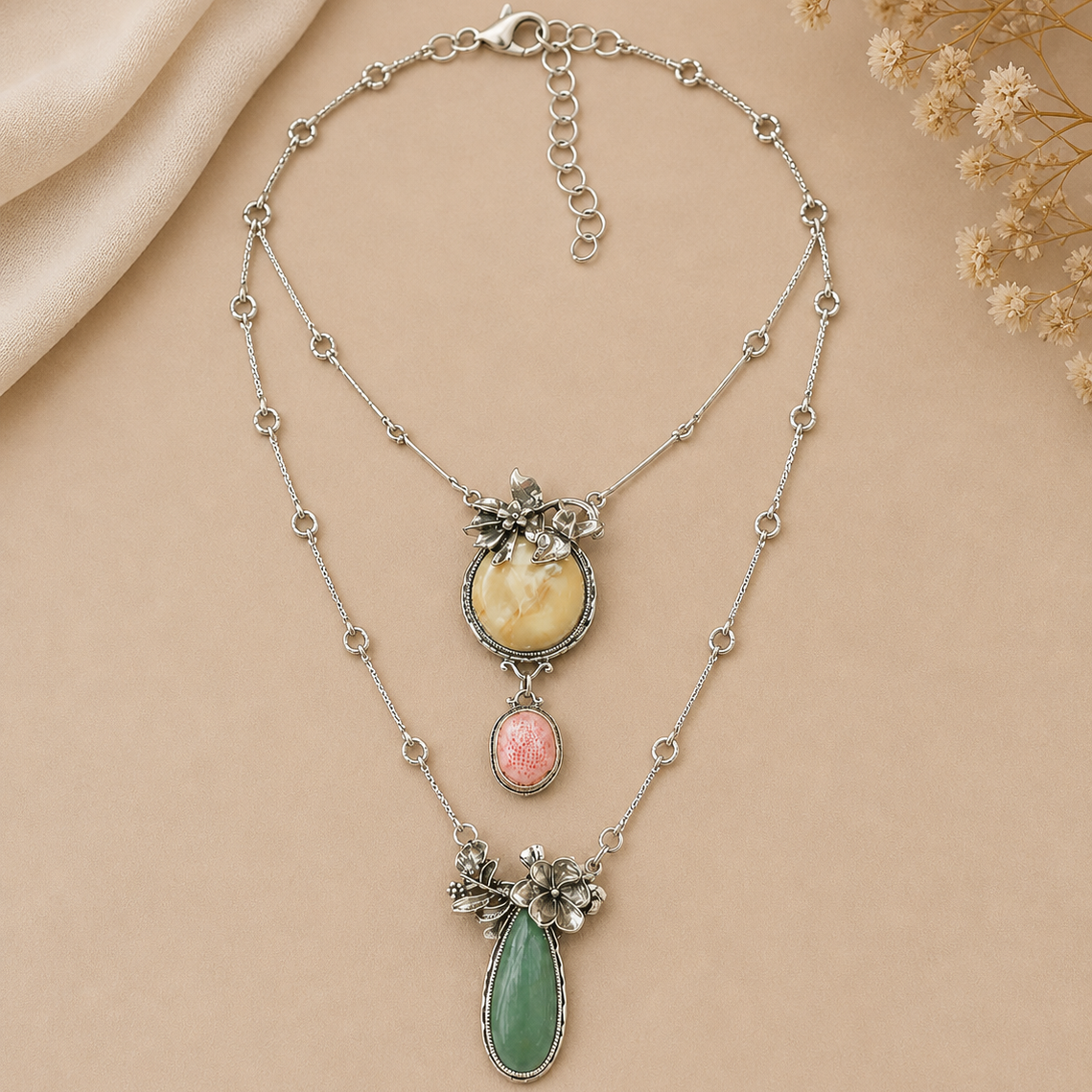 Necklace with floral and gemstone details on a beige background