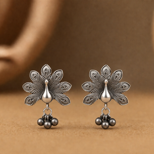 Pair of silver floral earrings.

