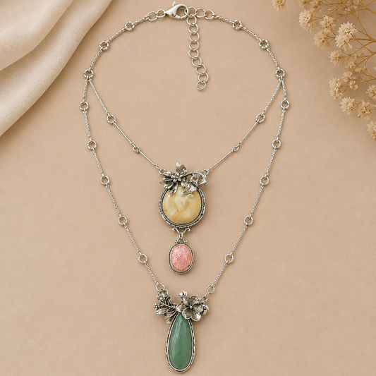 Necklace with floral and gemstone details on a beige background