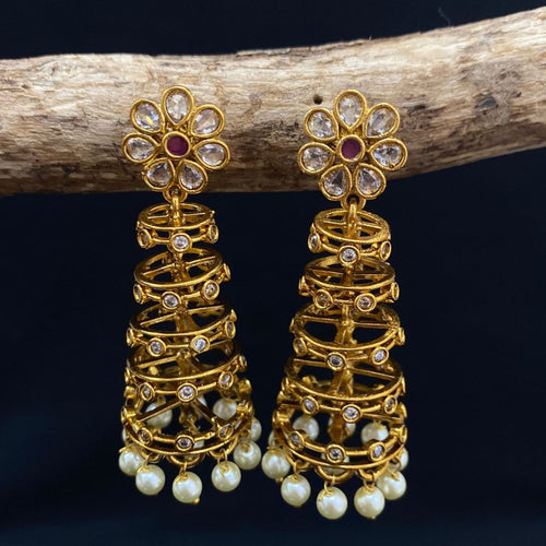 Gold earrings with floral design and pearl drops.
