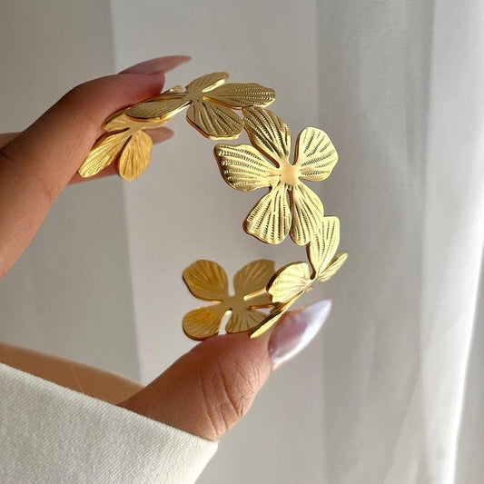 Flower Gold bracelet with decorative elements.