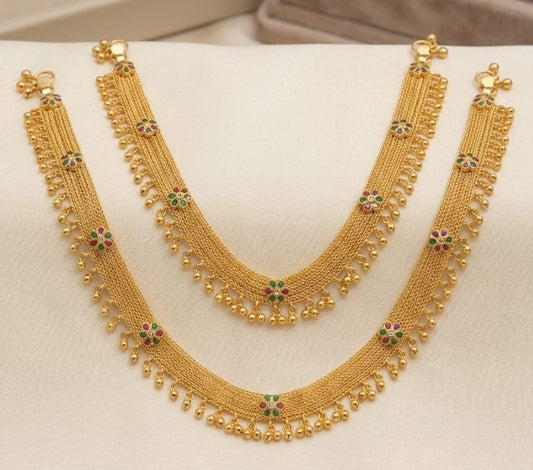 Gold Anklets with gemstone.
